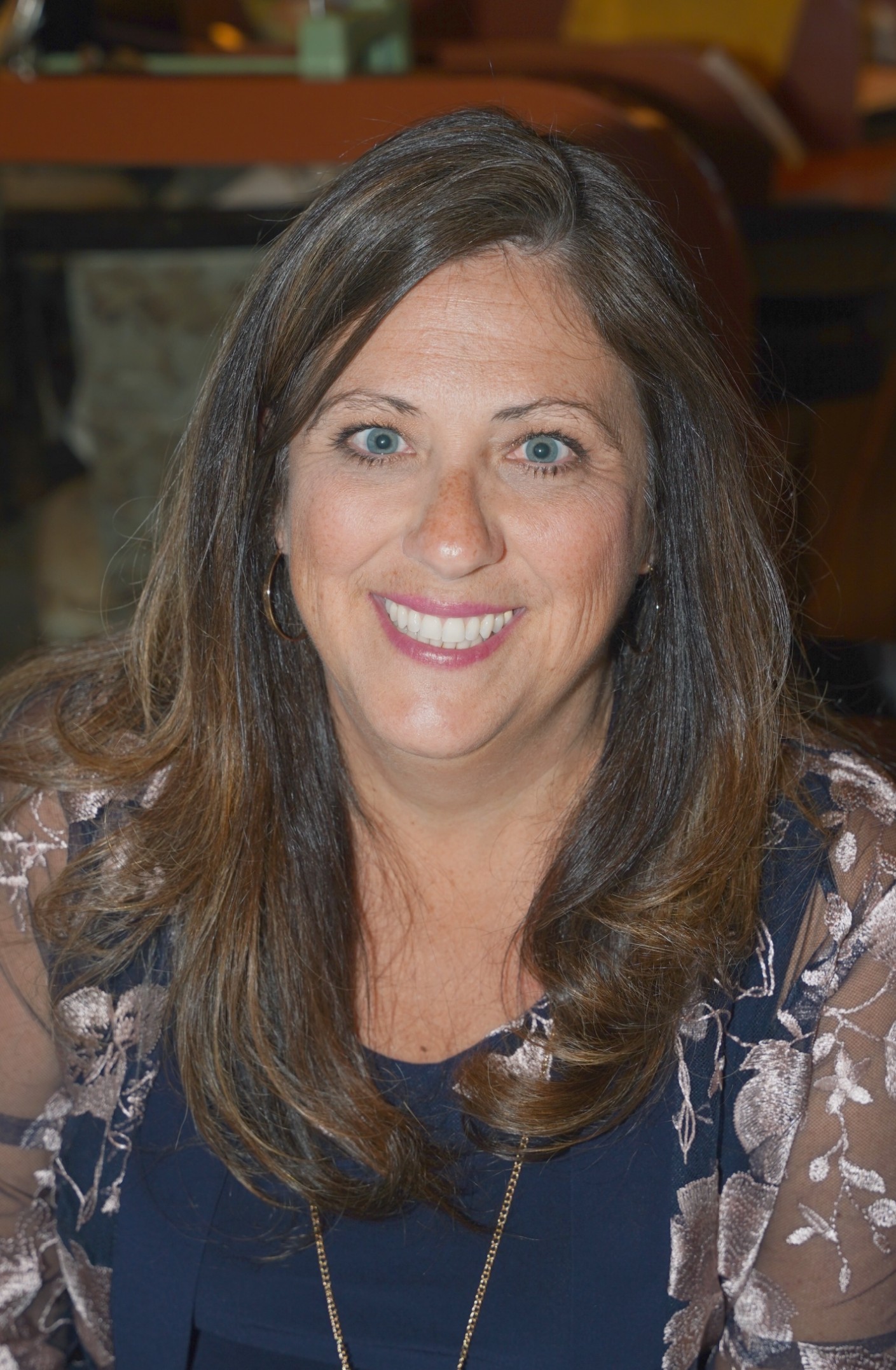 Elementary principal smiling for a photo